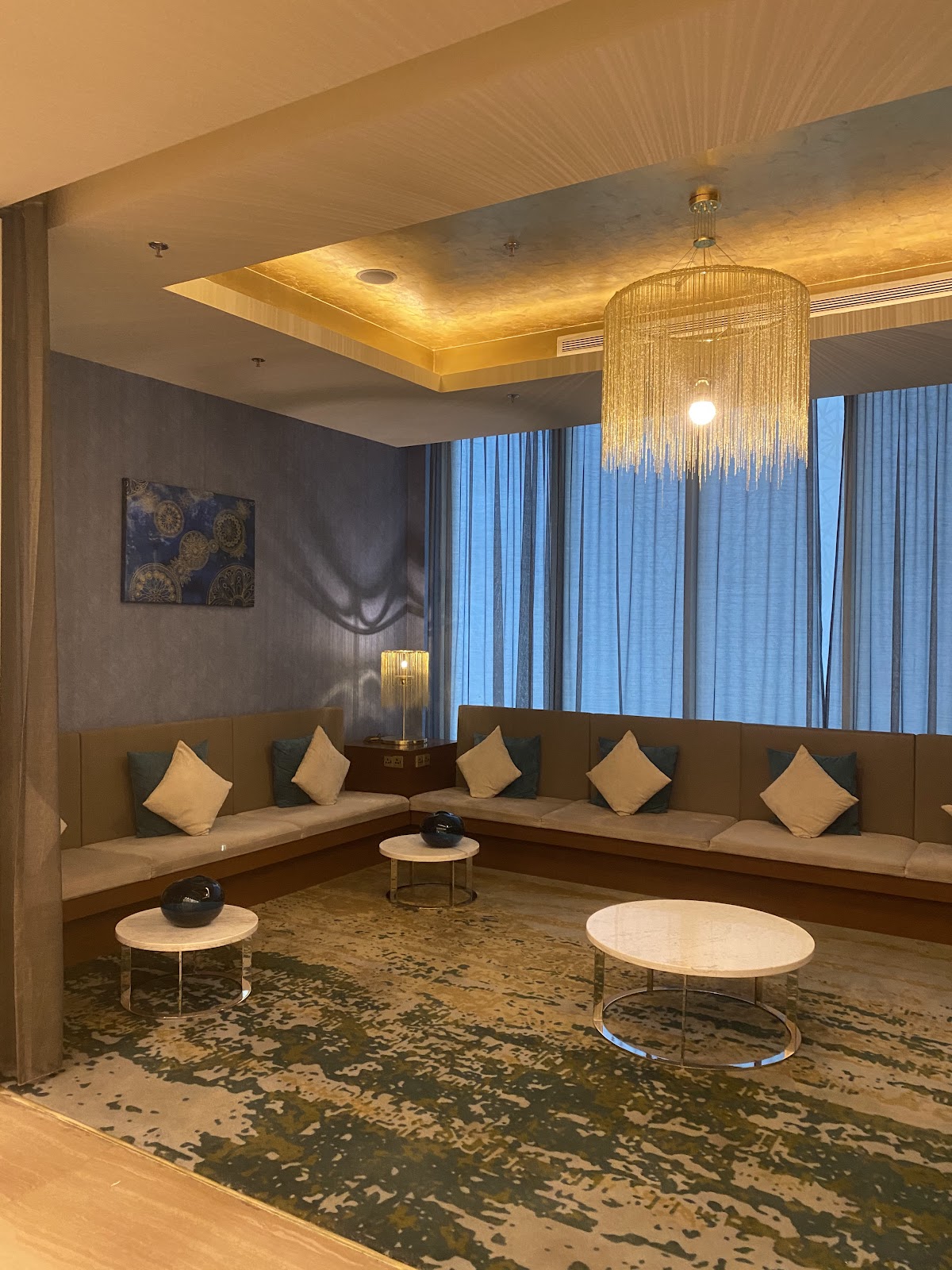 A stylish and comfortable communal lounge area, offering ample seating for guests to relax.